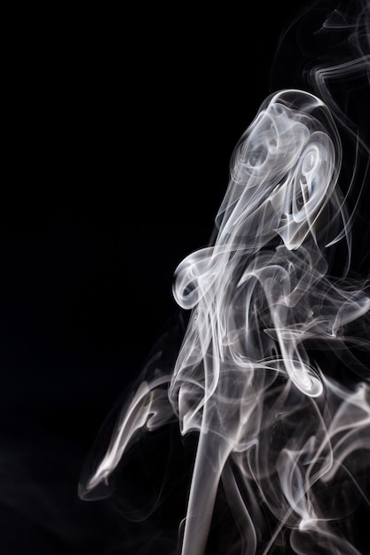 White smoke on black background.