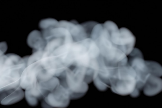 Photo white smoke fragments on black background