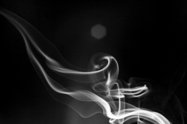 White  smoke motion on black background.