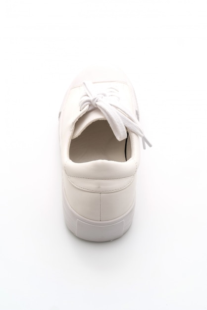 white sneakers on white background