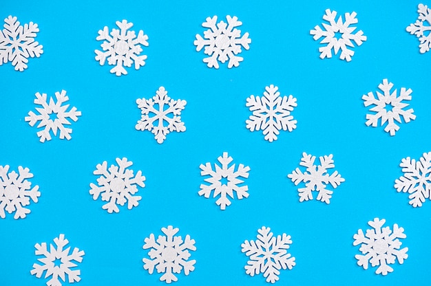 white snowflakes on a blue background