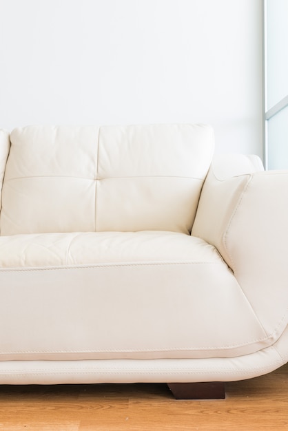 White sofa near glass partition