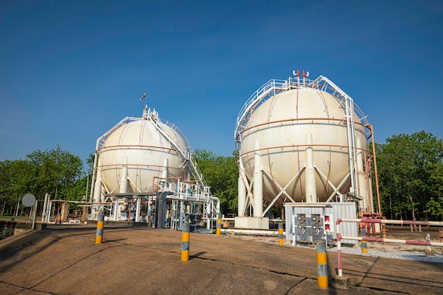 White spherical propane tanks containing fuel gas