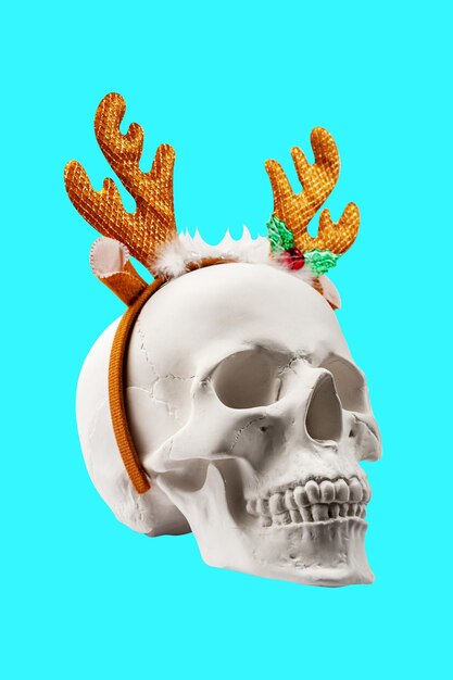 White spooky skull with deer horns isolated on blue green background funky hard xmas decor crazy