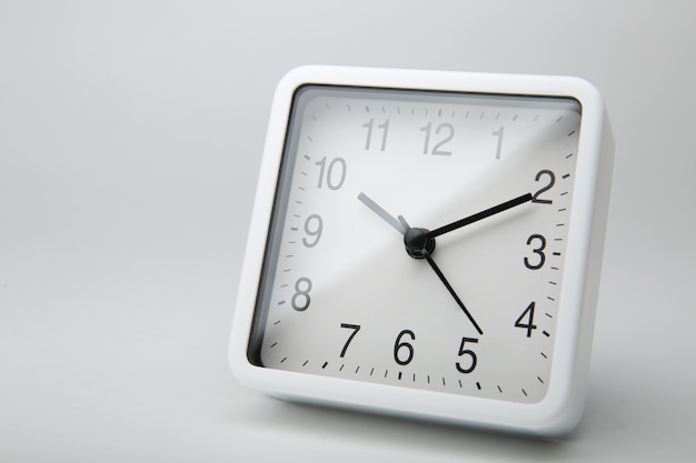 White square alarm clock isolated on white