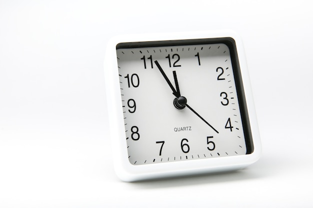 White square alarm clock isolated on white