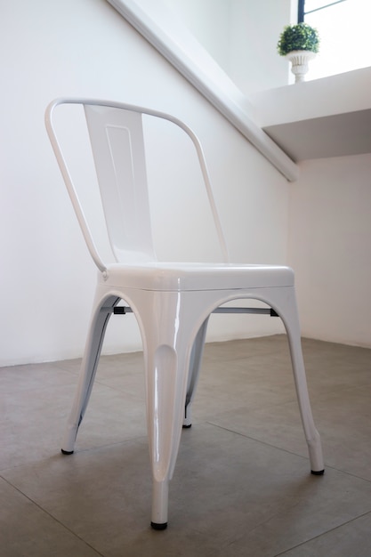 White steel chair in white room