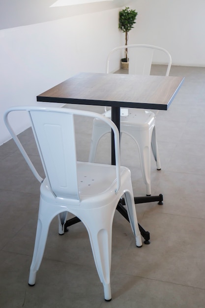 White steel chair and wooden table