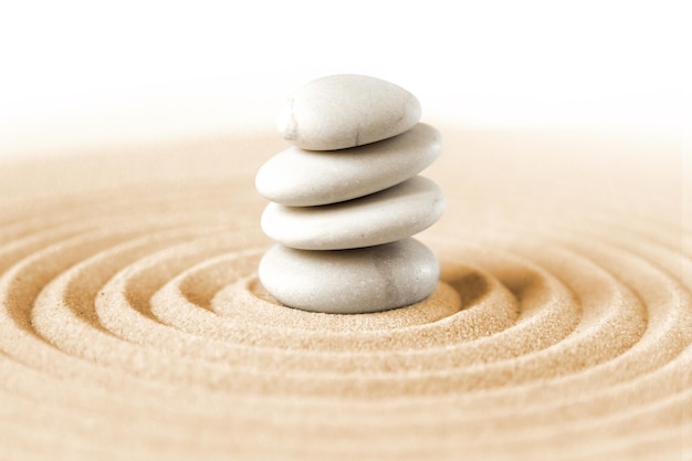 White stones pile in the sand Zen japanese garden background scene