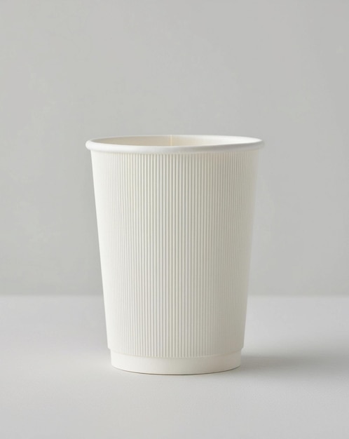 a white styrofoam cup with a white lid is shown