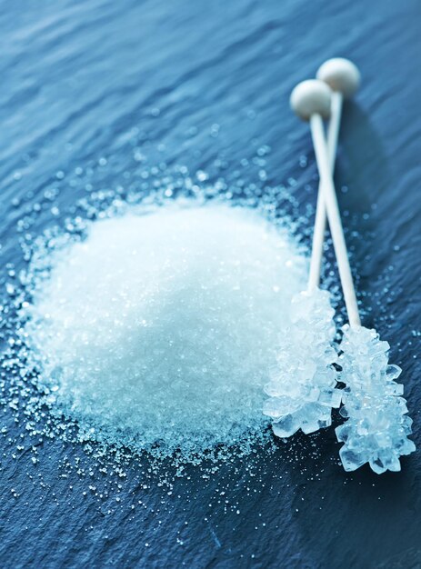 White sugar crystals on the gray board