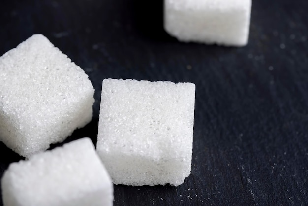 White sugar made from beetroot cubes of white beet sugar closeup