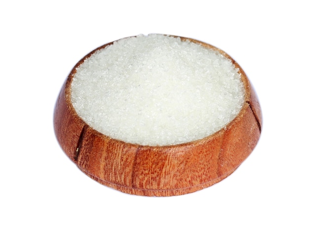 White Sugar on a wooden bowl over white background