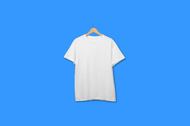 White t shirt on wooden hanger floating on plain background