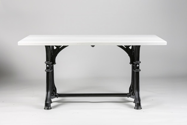 a white table with black legs