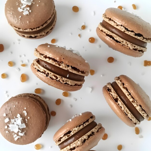 a white table with cookies and one of the cookies has a brown and gold design