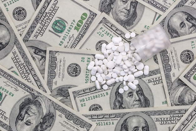 White tablets are scattered for dollars .