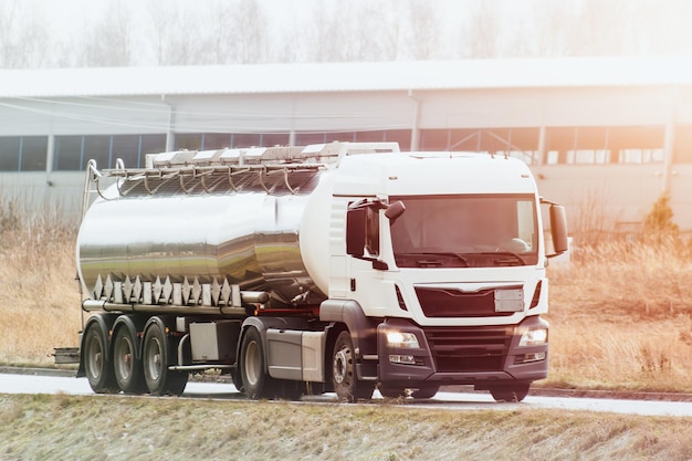 A White Tank Truck on the road Delivering Goods Safely including liquid petroleum gas LPG or propane