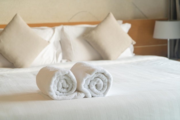 White towel on bed in bedroom