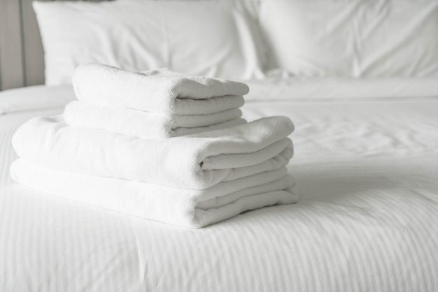 White towel on bed decoration in bedroom interior 