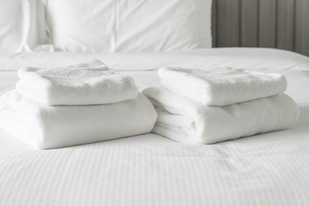 White towel on bed decoration in bedroom interior 