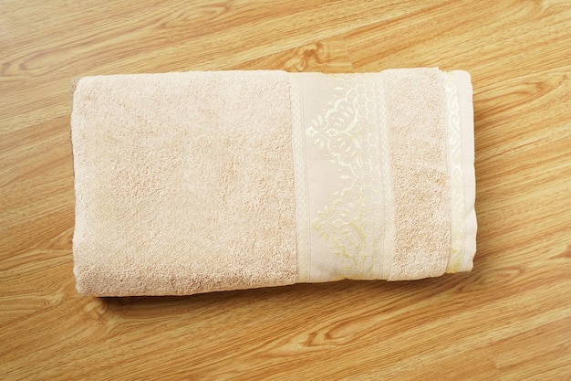 a white towel with the word hotel on ittowels on wooden in bathroom decor and Spac