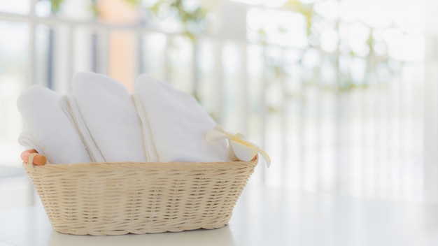 White towels in basket in bathroom