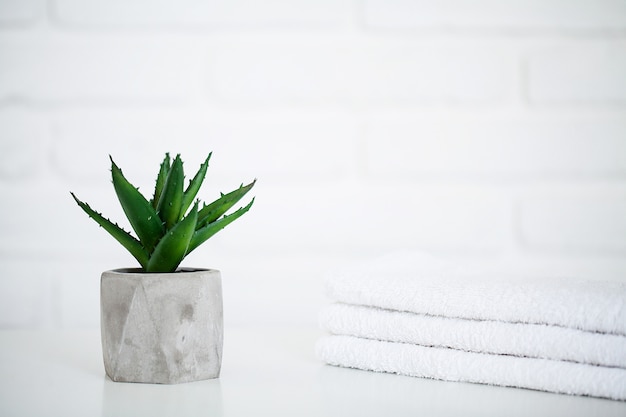 White towels on white table with copy space on bath room  