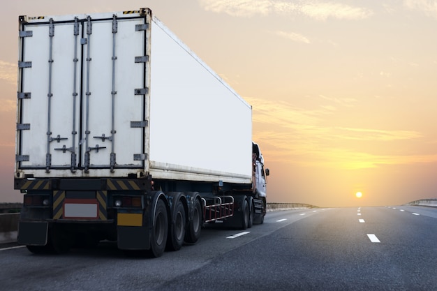 White Truck on highway road with container, transport on the asphalt expressway           