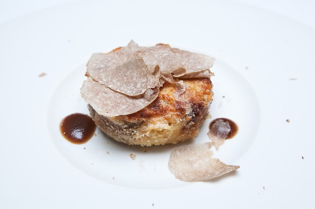 White Truffle mushroom slide on food in white plate. White Truffle mushroom is Queen of mushroom.