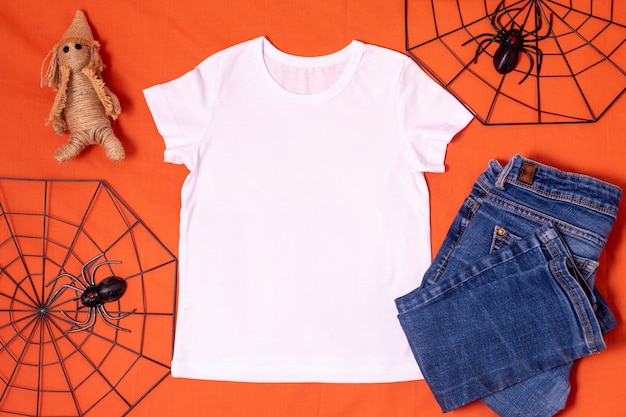 White tshirt mockup on orange halloween background