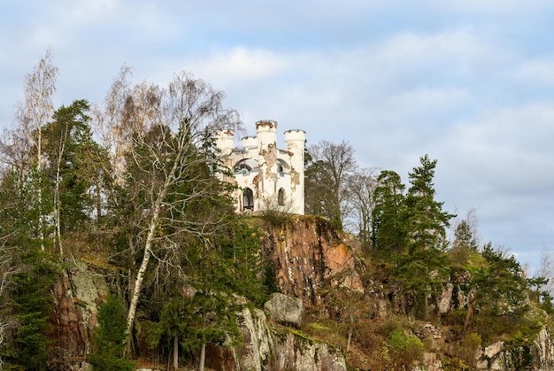 White turrets of the Chapel in Ludwigsburg Park mon repos in Vyborg on the background of blue sky