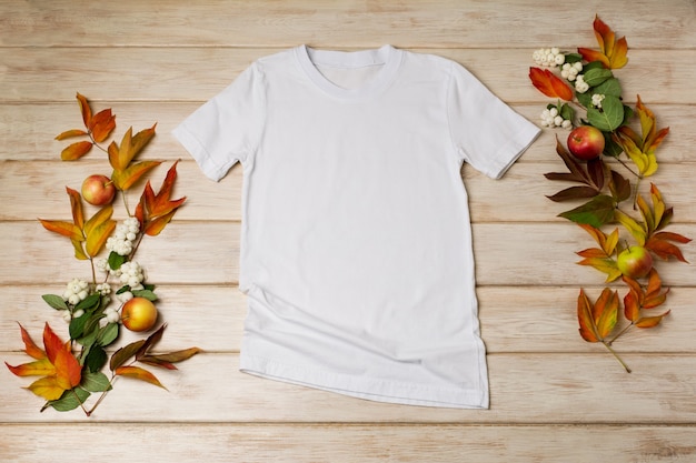 White unisex cotton Tshirt mockup with snowberry red and green fall leaves