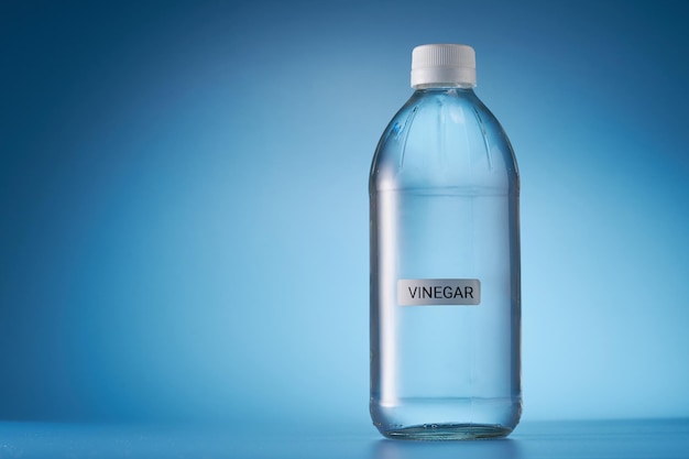 White vinegar against blue background