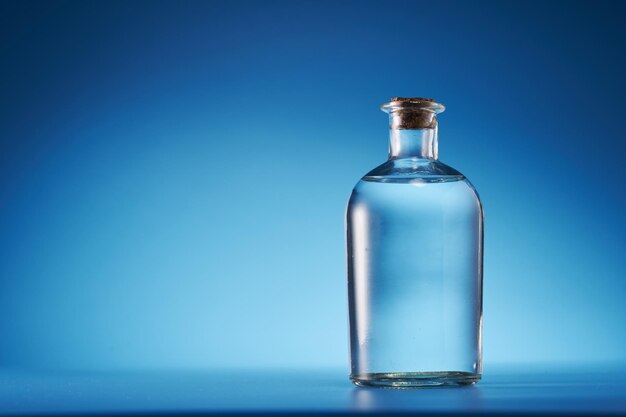 White vinegar against blue background