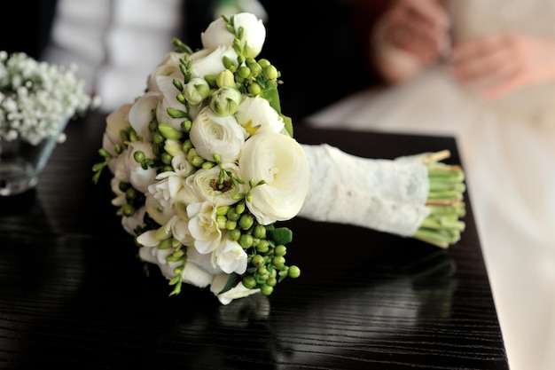 White wedding bouquet on the table