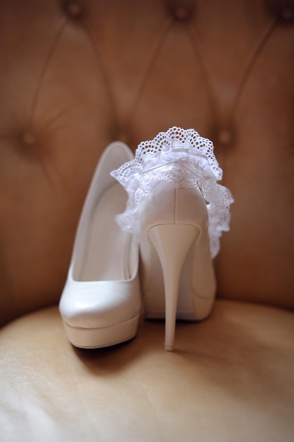 White wedding shoes of bride close up