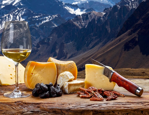 White wine accompanied by various cheeses