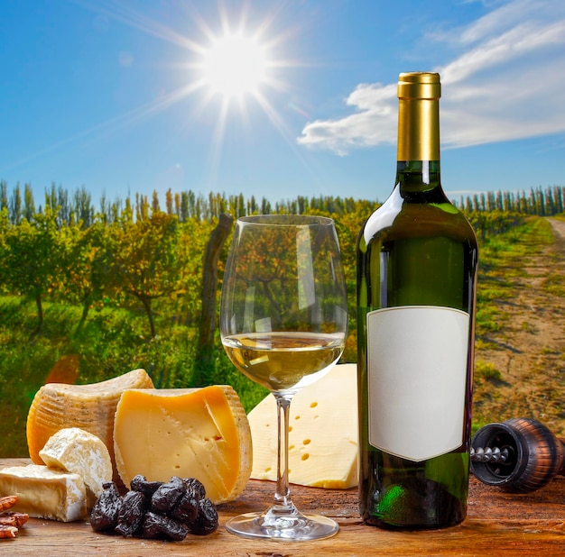 White wine accompanied by various cheeses