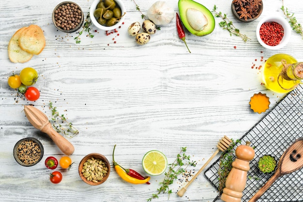 White wooden background with vegetables and spices.Top view. Rustic style.