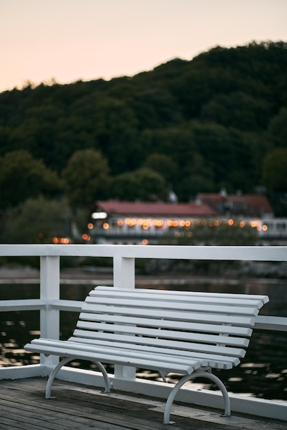 White wooden bench on the pier at the Baltic Sea Recreational infrastructure in Gdansk Poland