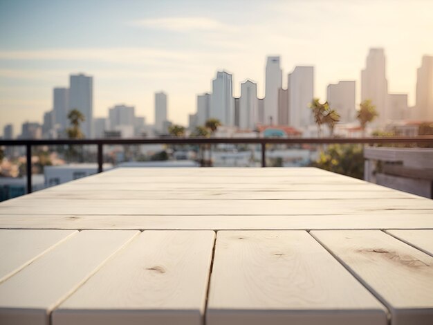 white wooden table in front of abstract blurred los angeles city background