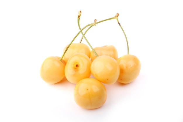 White yellow cherries isolated on white background