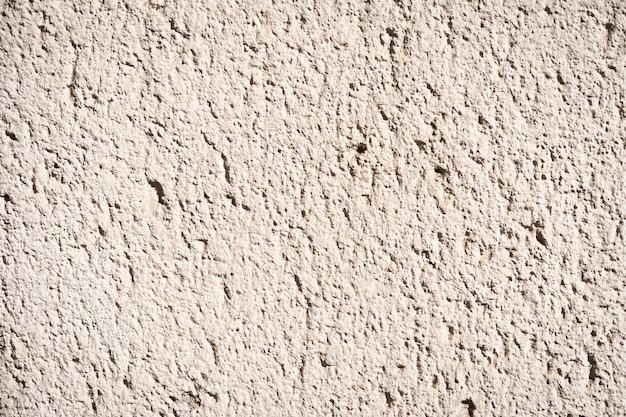 Photo white and yellow exterior plaster spray texture coarse texture