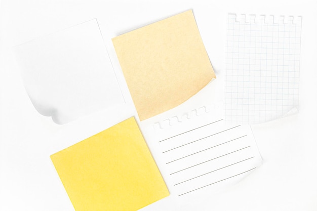 white and yellow sheets of paper on a white background