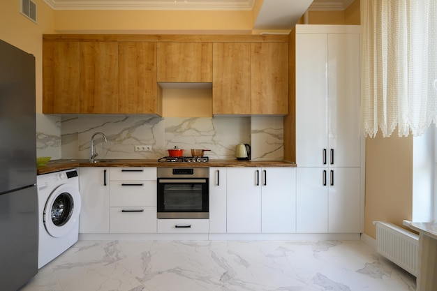 White and yellow wooden modern kitchen interior