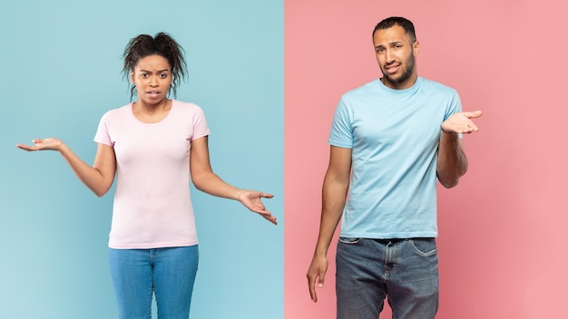 Who knows Confused black guy and lady shrugging shoulders looking at camera posing on halved pink and blue background