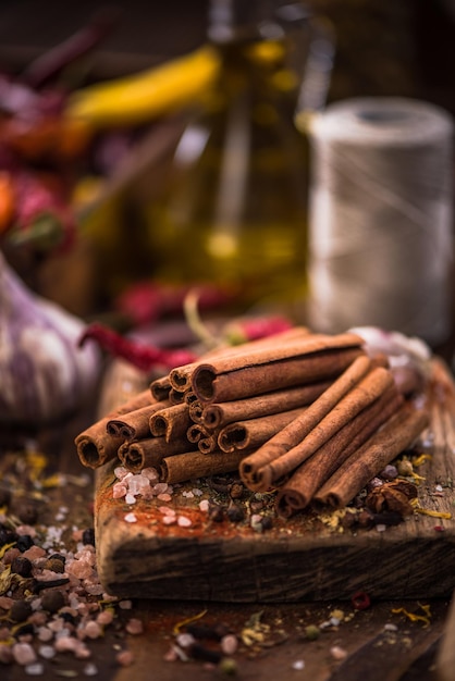 Whole cinnamon stocks on wooden boar Spices concept