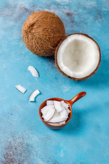 Whole coconut and various pieces of coconut