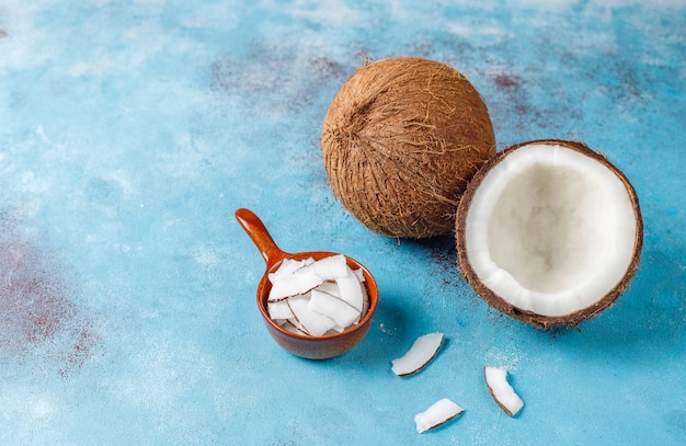 Whole coconut and various pieces of coconut